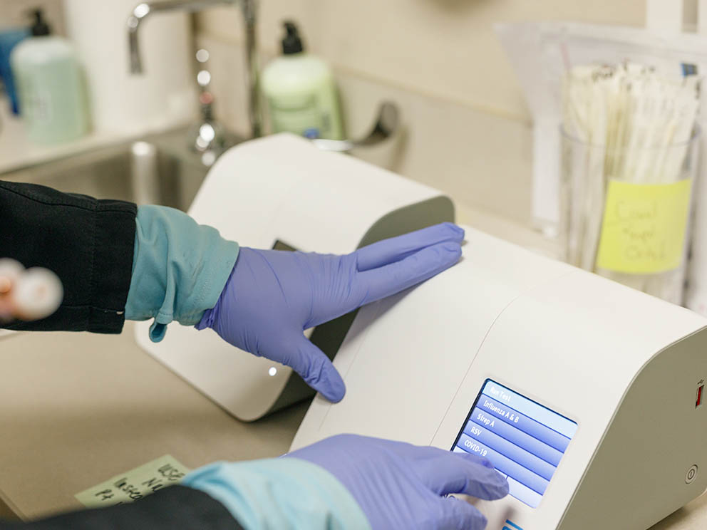 Photo of nurse prepairing to administer a vaccination.